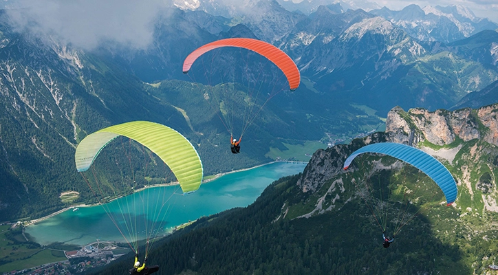 Thrilling Paragliding Ride Over Scenic Gangtok Hills Experience the joy of paragliding above Gangtok's green valleys and panoramic mountain views.
